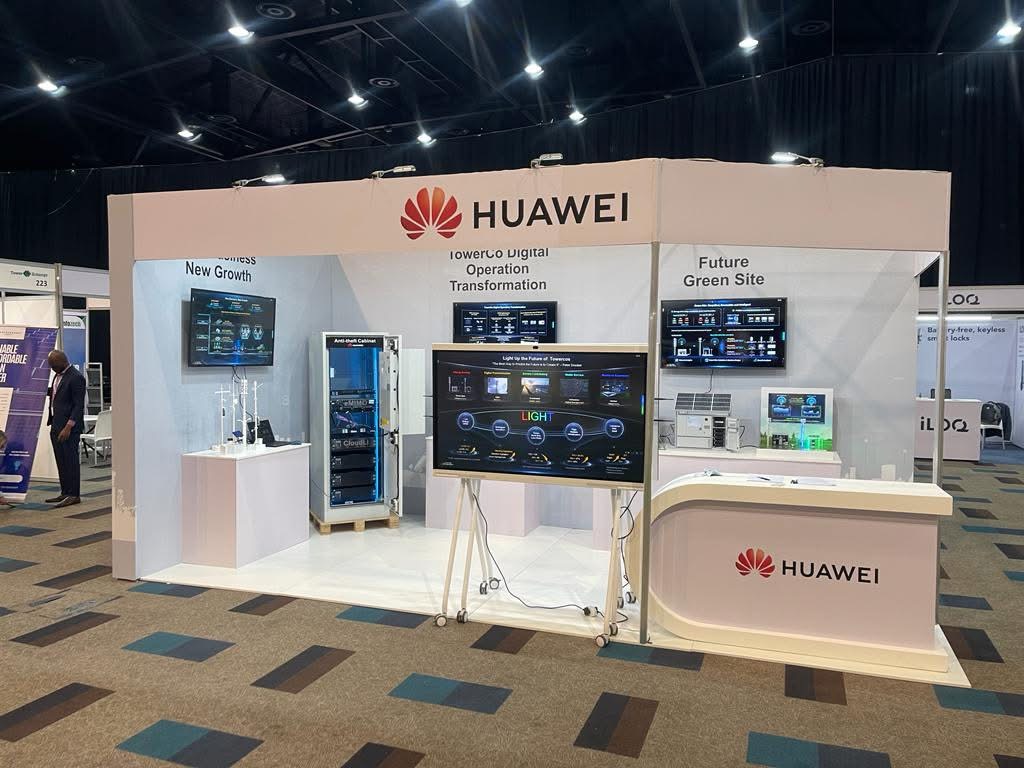 EBS exhibition booth setup inside a large expo hall with lights and banners